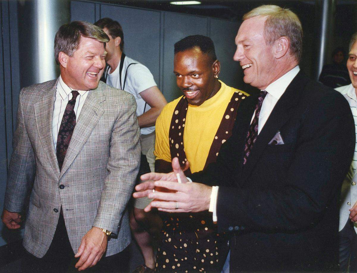 April 22, 1990: Dallas Cowboys coach Jimmy Johnson, left, Emmitt Smith, center, and owner Jerry Jones make their way to a press conference announcing Smith as the Cowboys’ No. 1 pick in the NFL draft.
