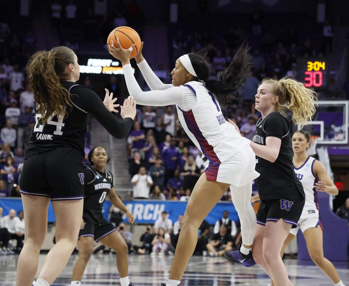 TCU guard Taylor Bigby (1) grabs a defensive rebound against Washington during overtime of a second round NCAA Division I Women's Basketball Championship game at Schollmeier Arena in Fort Worth, Texas, Sunday, March, 22, 2026.