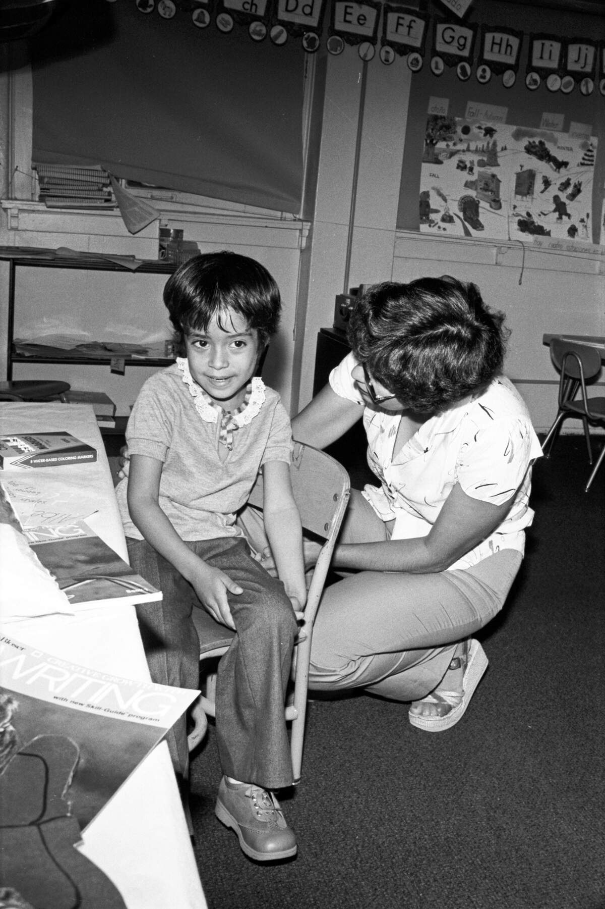 Sept. 5, 1980: The daughter of an undocumented worker on the first day of school with Denver Avenue Elementary School (since renamed Rufino Mendoza Sr. Elementary) in Fort Worth, with teacher Rosemary Saldana. Children of non-citizens were able to register for school as a result of a July 1980 federal court ruling that they cannot be excluded from Texas schools or forced to pay tuition. The court concluded that education was a state function and should be provided to all.