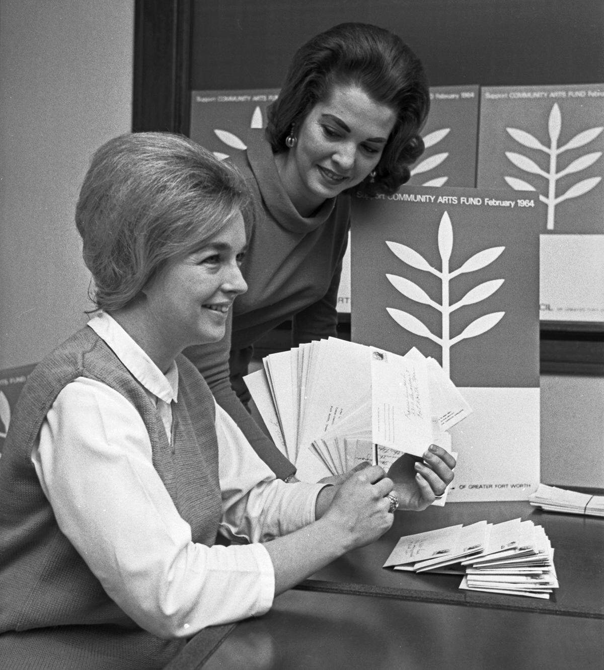 Mrs. George Q. McGown III and Mrs. Roy Pearce, volunteers who opened mail and tabulated gifts for the Community Arts Fund in 1964.