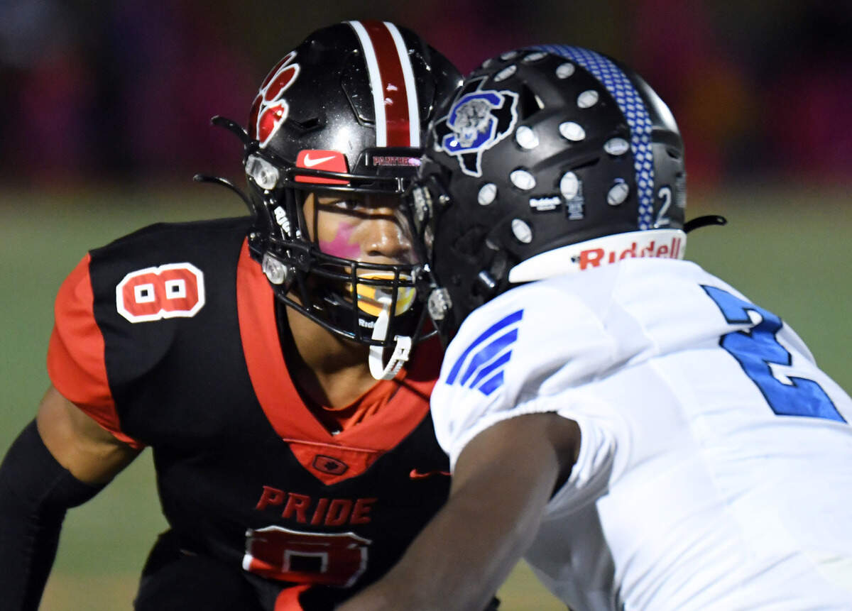 Colleyville Heritage’s Dylahn McKinney, left, faces off against Mansfield Summit receiver Kerya Powell in the second quarter of their district 4-5A Division 1 football game Friday, October 15, 2021 at Mustang-Panther Stadium in Grapevine, Texas. Heritage went on to win 35-34. Special/Bob Haynes