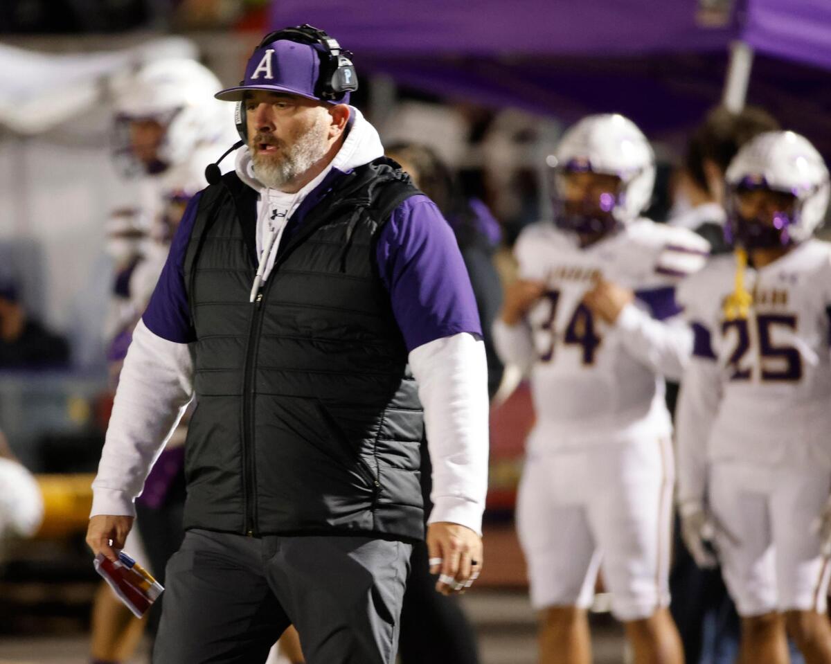 Alvarado head coach Casey Walraven heads back to the sidelines after a timeout during the UIL 4A D1 Quarterfinals at Mustang-Panther Stadium in Grapevine, Texas, Friday, Dec. 06, 2024.