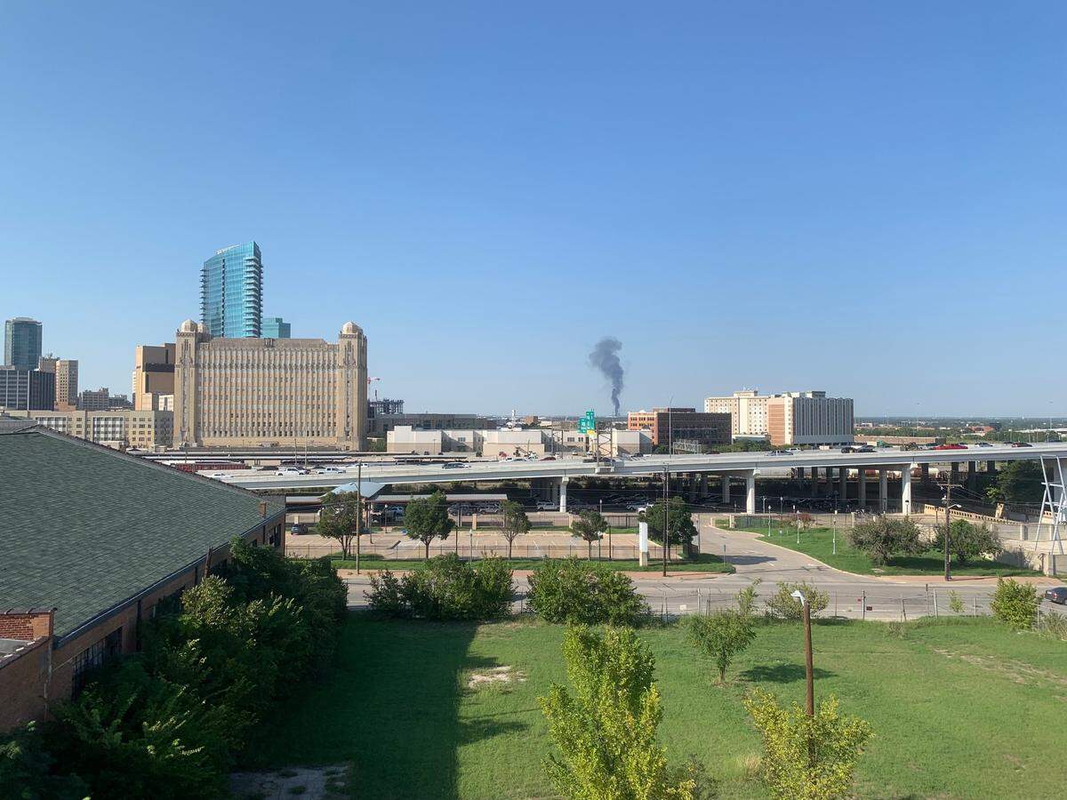 Two people were burned in a business fire that erupted Monday afternoon in north Fort Worth, authorities said. A firefighter also sustained a minor injury.