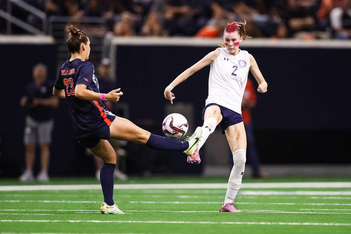 Grapevine forward Chloe O'Steen (2) puts her foot in the air attempting to block a pass from a Frisco Wakeland player in a Class 5A Division II UIL girls soccer state semifinal at the Ford Center on April 3, 2026 in Frisco, Texas.