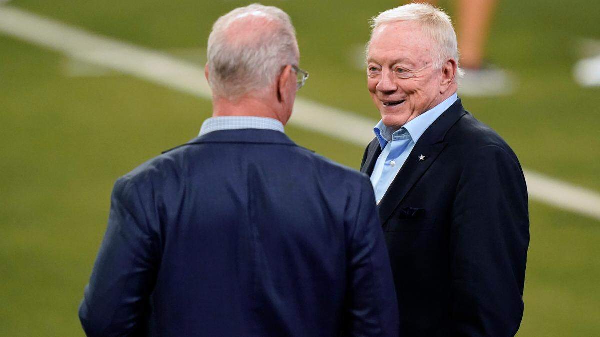 Dallas Cowboys owner Jerry Jones, right, talks with his son Stephen Jones during a practice in May at The Star in Frisco.