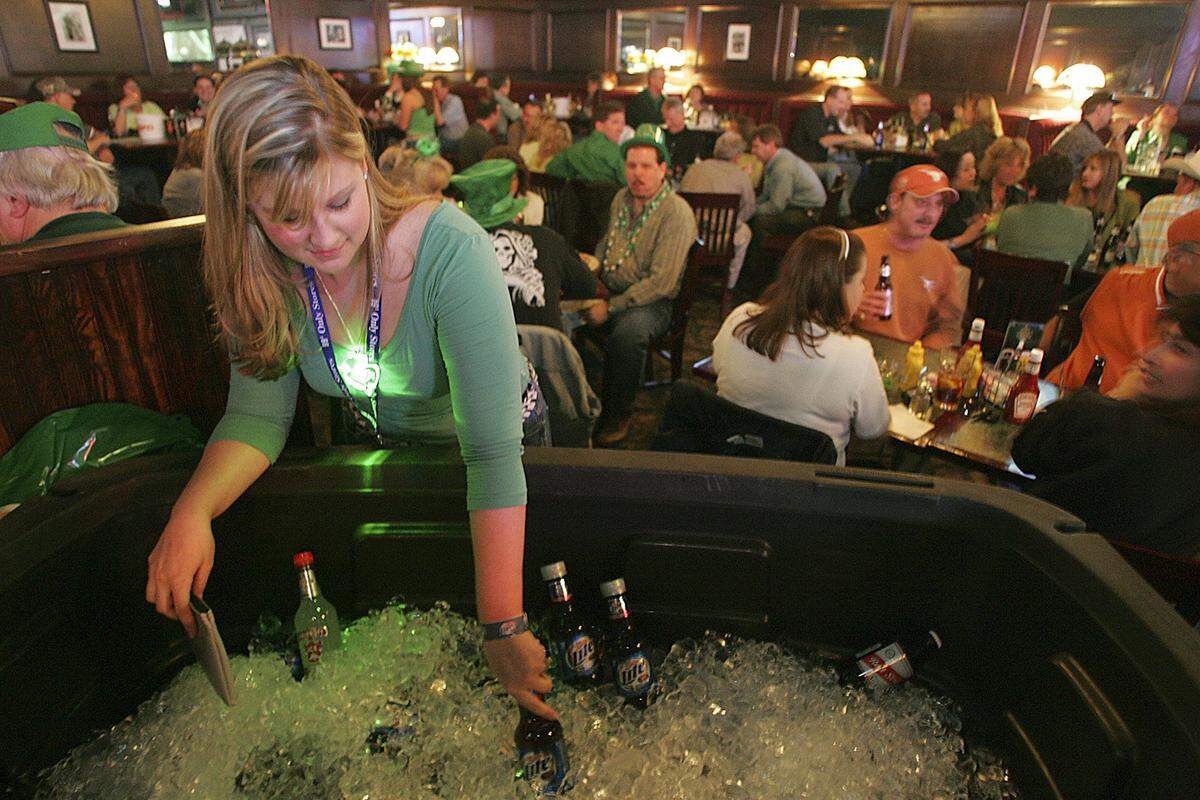 March 17, 2005: Erin Stacy of Keller stocks bottled beer in an ice chest at the St. Patrick’s All-day Party at Lonnegan’s Grill and Sports Pub in Grapevine. The business was expecting to see over 3,000 patrons during the evening celebration.