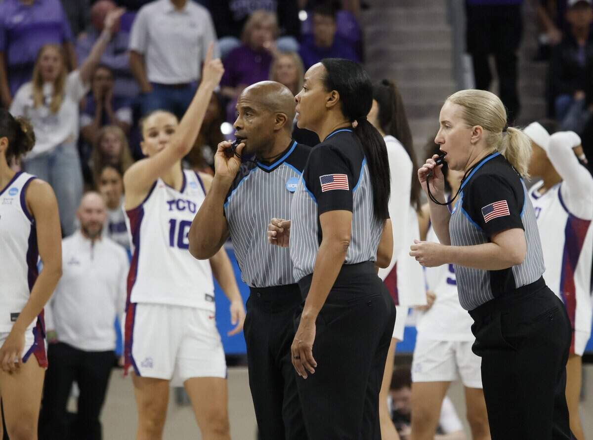 Game officials gather at center court to discuss the quick shot clock that should have been reset after an attempt hit the rim during the second half of a second round NCAA Division I Women's Basketball Championship game at Schollmeier Arena in Fort Worth, Texas, Sunday, March, 22, 2026.