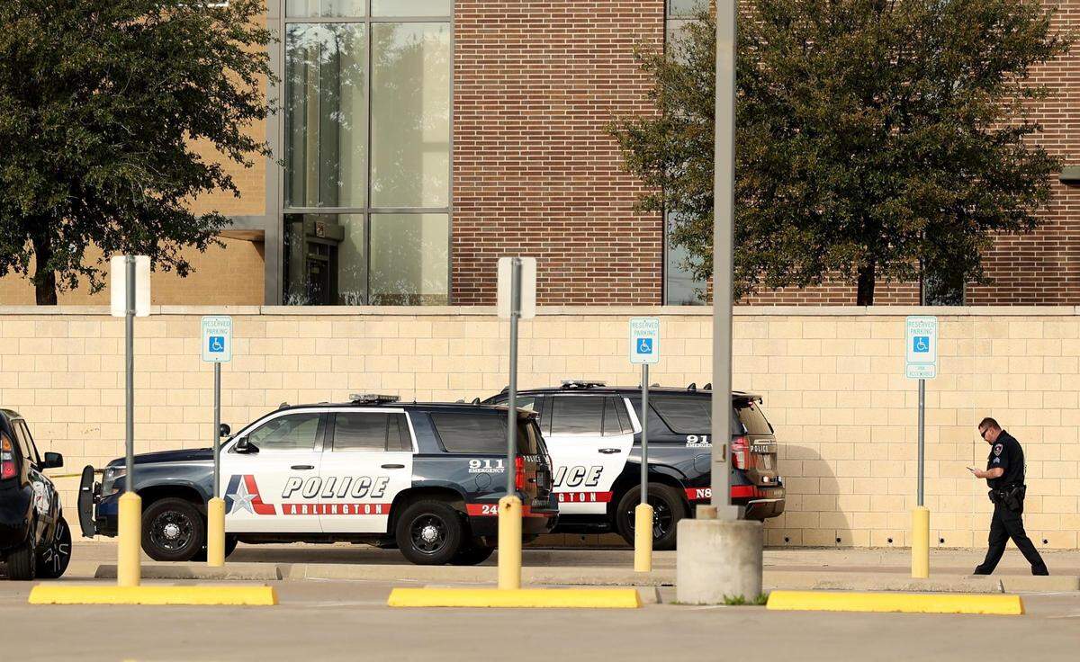 Arlington police investigate a shooting at Lamar High School in Arlington on March 20, 2023. Two students were shot, one fatally.