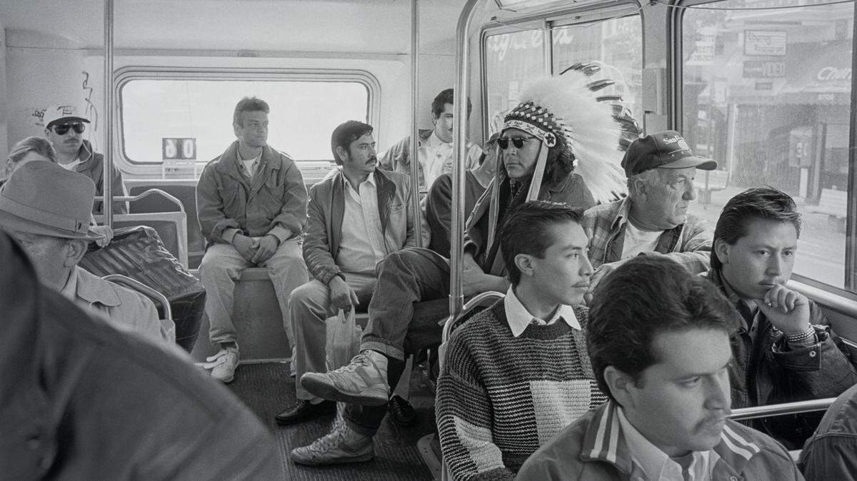 Zig Jackson (Mandan/Hidatsa/Arikara) (b. 1957), “Indian Man on the Bus,” Mission District, San Francisco, California, 1994, inkjet print, Amon Carter Museum of American Art, Fort Worth, Texas, P2021.7, © Zig Jackson Mandan, Hidatsa, Arikara, North Dakota.
