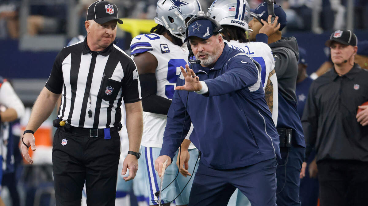 Dallas Cowboys head coach Mike McCarthy, right, gestures while talking to an official during his team’s 23-17 playoff loss Sunday to the San Francisco 49ers at AT&T Stadium.