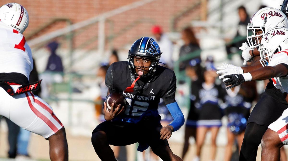 North Crowley quarterback Chris Jimerson (12) hits the hole during the first half of a UIL Conference 6A Division I state semifinal football playoff game at Mesquite Memorial Stadium in Mesquite, Texas, Saturday, Dec. 09, 2023. Duncanville led North Crowley 24-0 at the half.