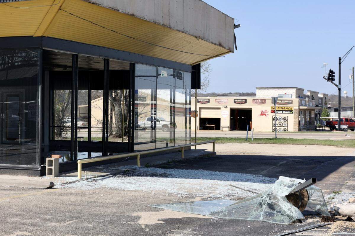 Windows are shattered in an empty retail building after Thursday’s severe thunderstorms.