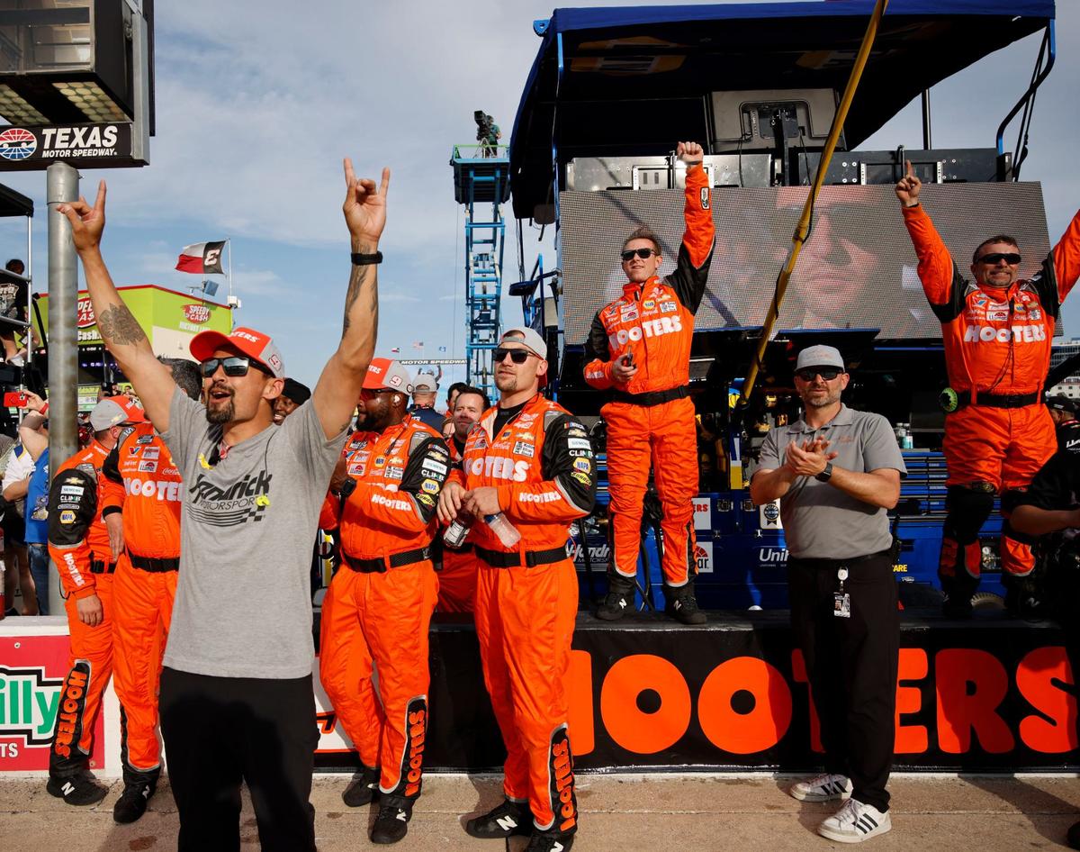 Hendrick Motorsports and Hooters pit members celebrate Chase Elliott (9) winning the Auto Trader Echo Park 400 at Texas Motor Speedway in Fort Worth, Texas, April 14, 2024. Kyle Larson won stage 1. (Special to the Star-Telegram/Bob Booth)