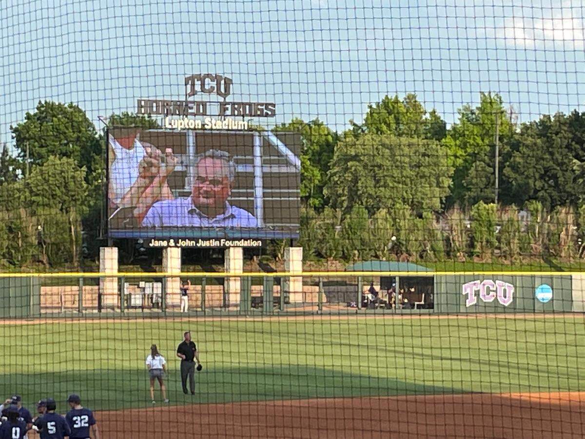 TCU head football coach Sonny Dykes takes in game two of the NCAA Super Regional at Lupton Stadium in Fort Worth. He was shown on the video board in left field.
