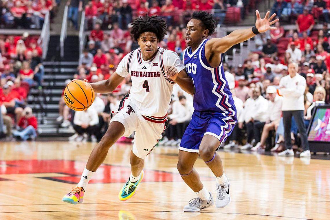 LUBBOCK, TEXAS - MARCH 03: Christian Anderson #4 of the Texas Tech Red Raiders handles the ball against Jayden Pierre #1 of the TCU Horned Frogs during the first half of the game at United Supermarkets Arena on March 03, 2026 in Lubbock, Texas. (Photo by John E. Moore III/Getty Images)