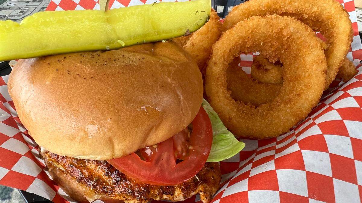 A blackened chicken sandwich with jalapenos and onion rings at Wing It Cafe.
