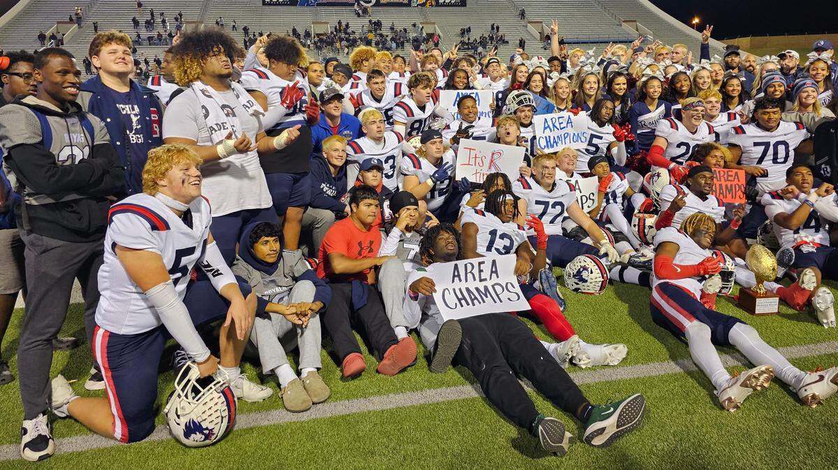 The North Richland Hills Richland football team poses with the area-round trophy after defeating Amarillo in a Class 5A Division 1 area-round game on Saturday, Nov. 23, 2024 at Memorial Stadium in Wichita Falls, Texas.