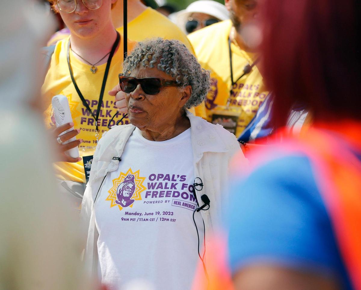 Ninety-Six-year-old Opal Lee is photographed between dozens of people who crowded around in front of her during Opal’s Walk for Freedom at Evans Street in Fort Worth, Texas, Monday June 19, 2023. More than 1500 registered for the walk. (Special to the Star-Telegram Bob Booth)