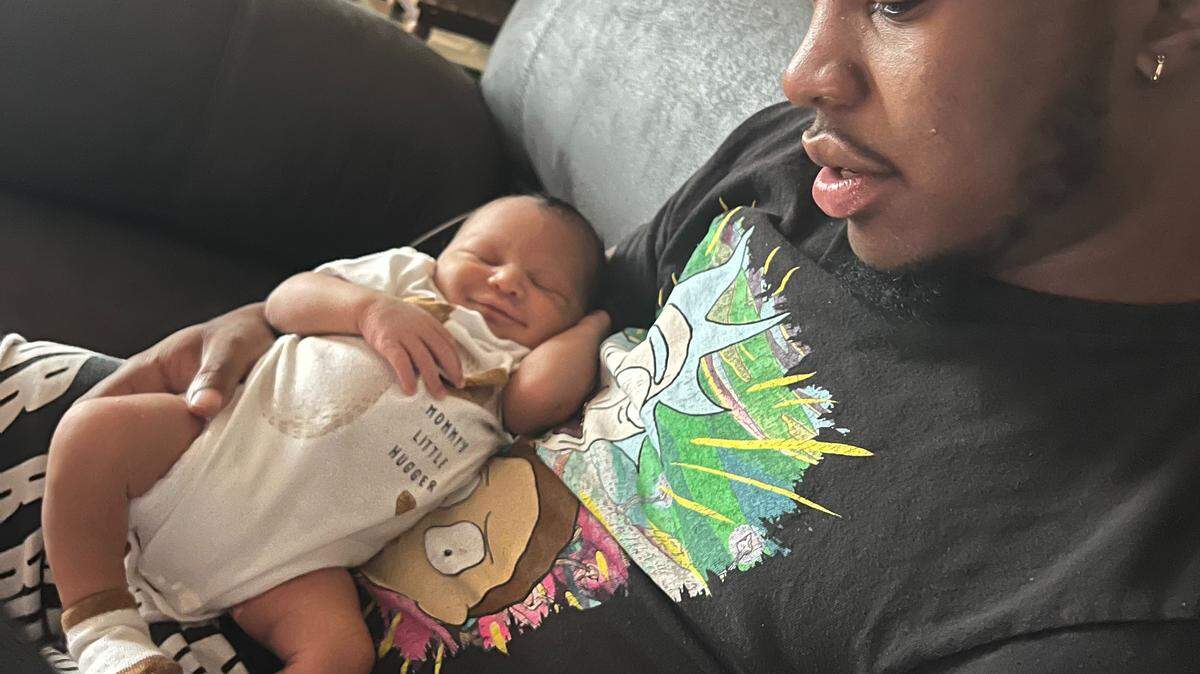 Darren Keith Stanley, Jr. with his son. Stanley died after being sent home from the hospital ER twice.