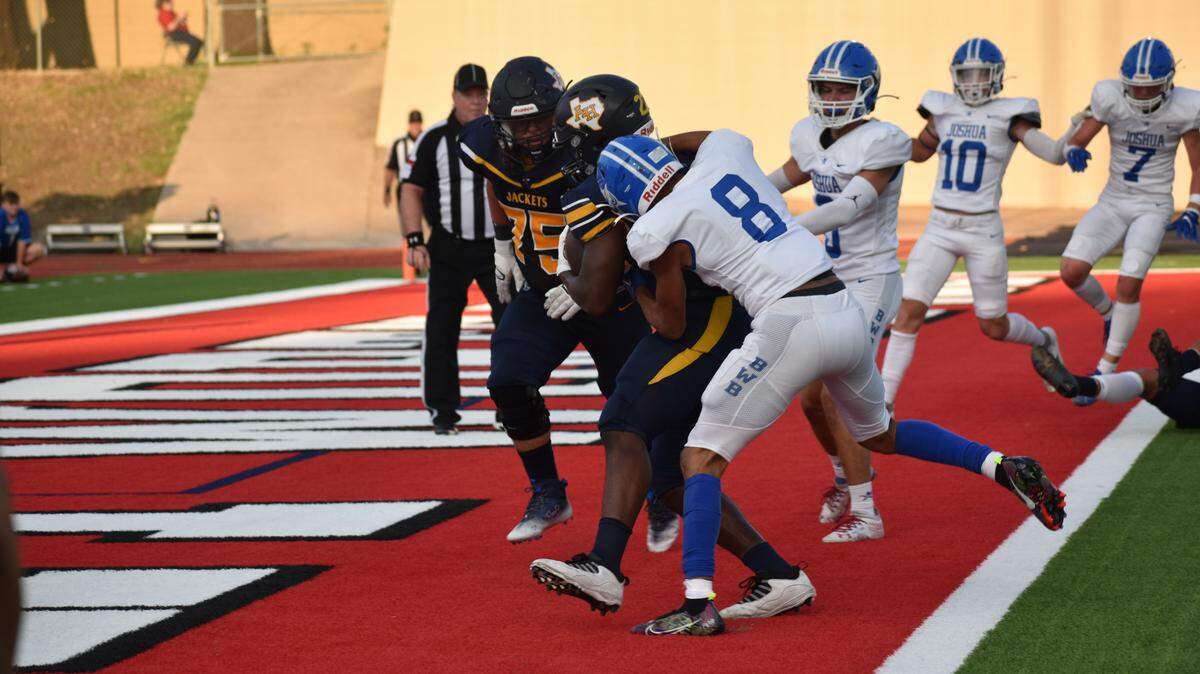 Arlington Heights Bryan Furch (22) scoring the first touchdown of the season during a high school football game against Joshua at Farrington Field in Fort Worth, Texas, Thursday, Aug. 25, 2022, Arlington Heights won 49-31. (Isaiah Thompkins/special to the Star-Telegram)