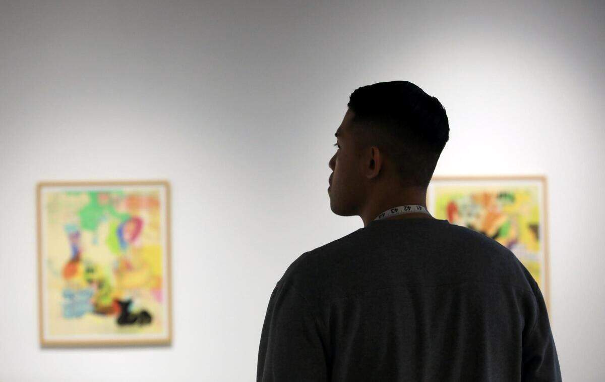 Phillip Maximilian, organizer of Fort Worth’s first fashion week, watches a run through for a Fort Worth Fashion Week show at Bale Creek Allen Gallery in downtown.