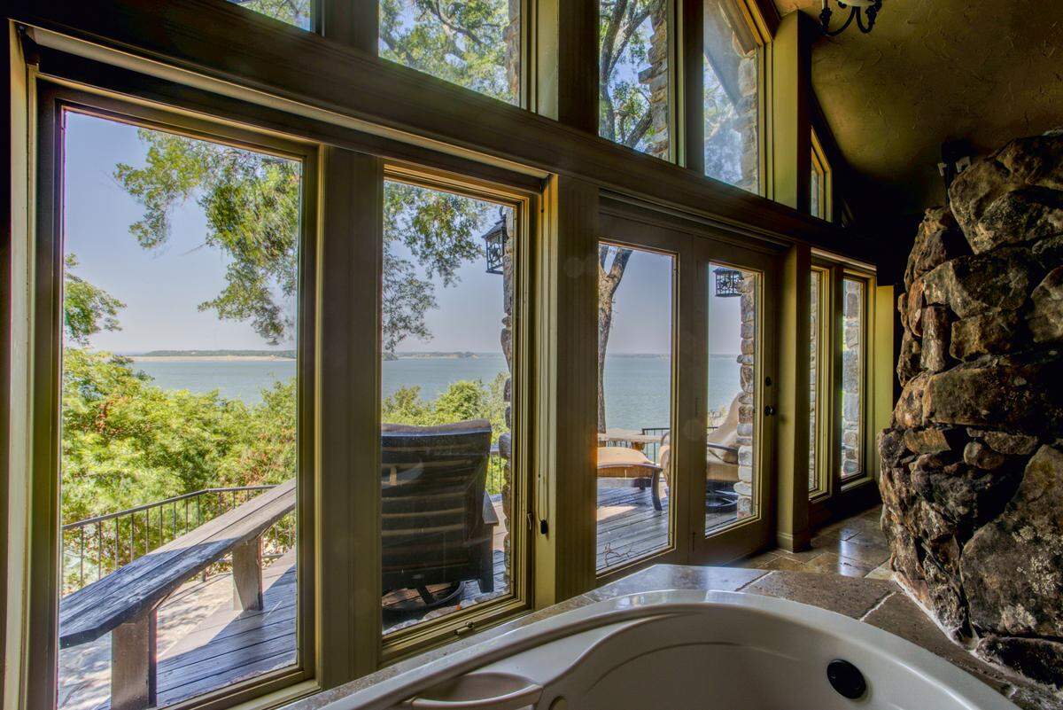 The master bathroom in 8935 Dickson Rd. has a private bathtub with 180-degree views of Eagle Mountain Lake.