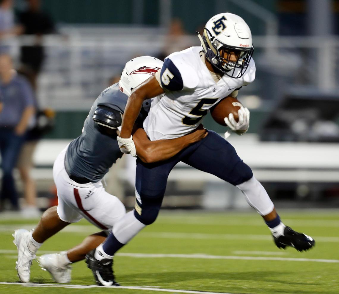 Little Elm running back Jason Jackson (5) is brought down by Keller Central linebacker Miles Skinner (2) during the first half of a high school football game at KISD Stadium in Keller, Texas, Saturday, Sept. 14, 2019. Central led 20-6 at the half. (Special to the Star-Telegram Bob Booth)