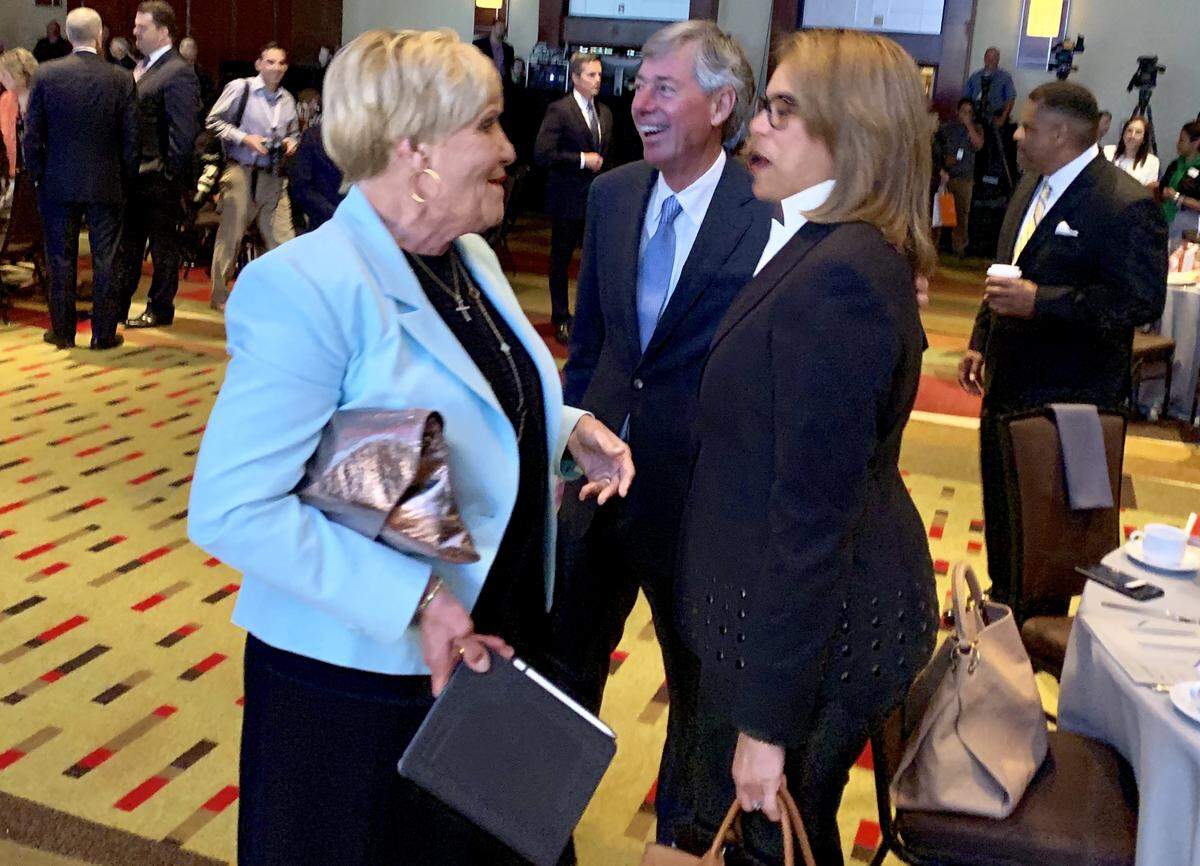 Fort Worth Mayor Betsy Price (left), DFW Airport board chairman William Meadows and vice chair Matrice Ellis-Kirk chat Monday before the DFW State of the Airport presentation.