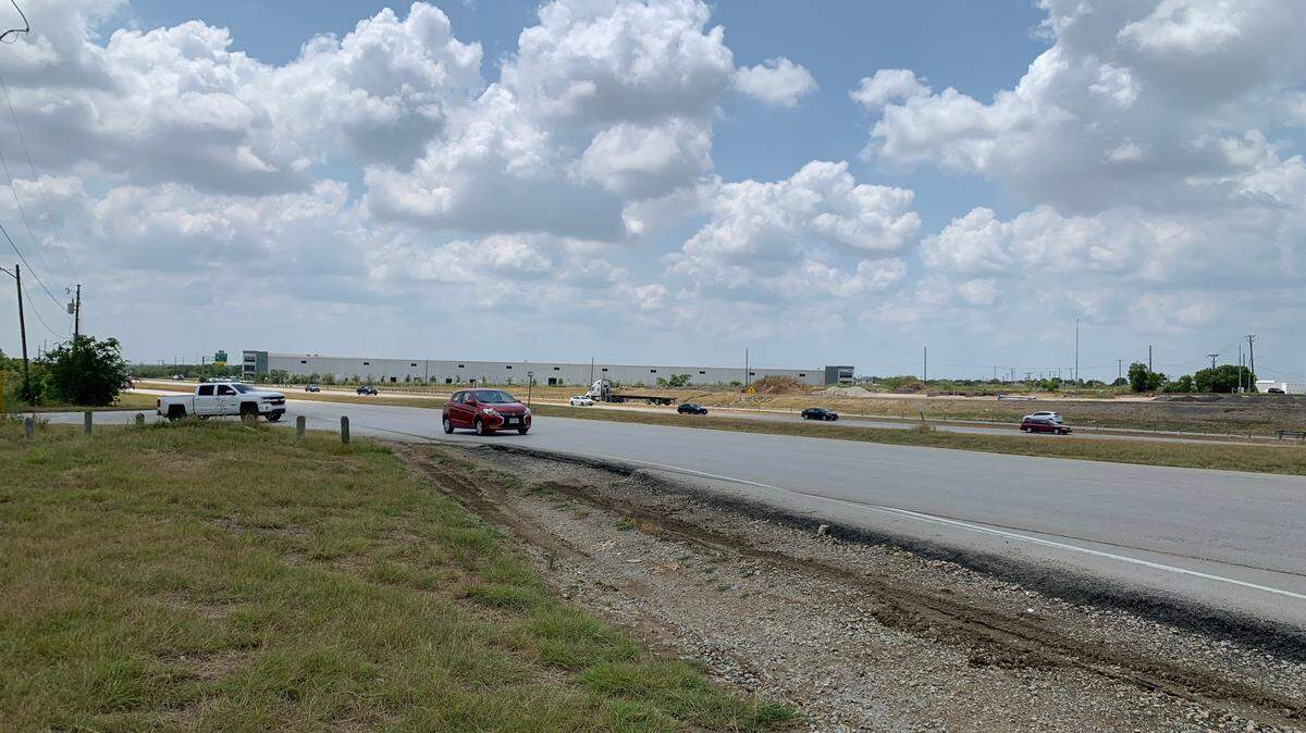Vehicles turn off North Tarrant Parkway and head to Harmon Road as cars blaze northward along US 287 in the background. TxDOT plans to expand the highway to accommodate more vehicles and ease traffic, but renovations will take years.