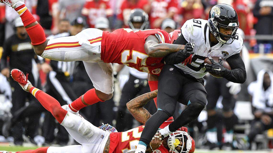 Kansas City Chiefs linebacker Anthony Hitchens and defensive back Jordan Lucas tackle Jacksonville Jaguars tight end Niles Paul in the fourth quarter during Sunday’s football game on Oct. 7, 2018 at Arrowhead Stadium in Kansas City, Mo. The Chiefs won, 30-14.