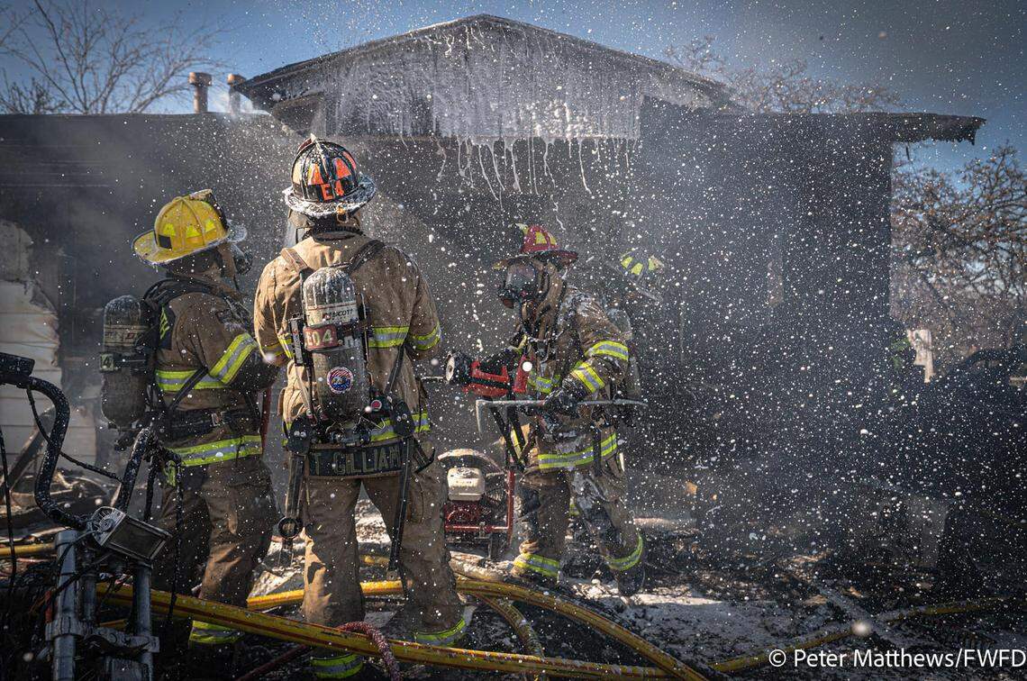 Fort Worth firefighters battle a blaze at a residence in the 4600 block of Shackleford Street in east Fort Worth on Dec. 31, 2025.
