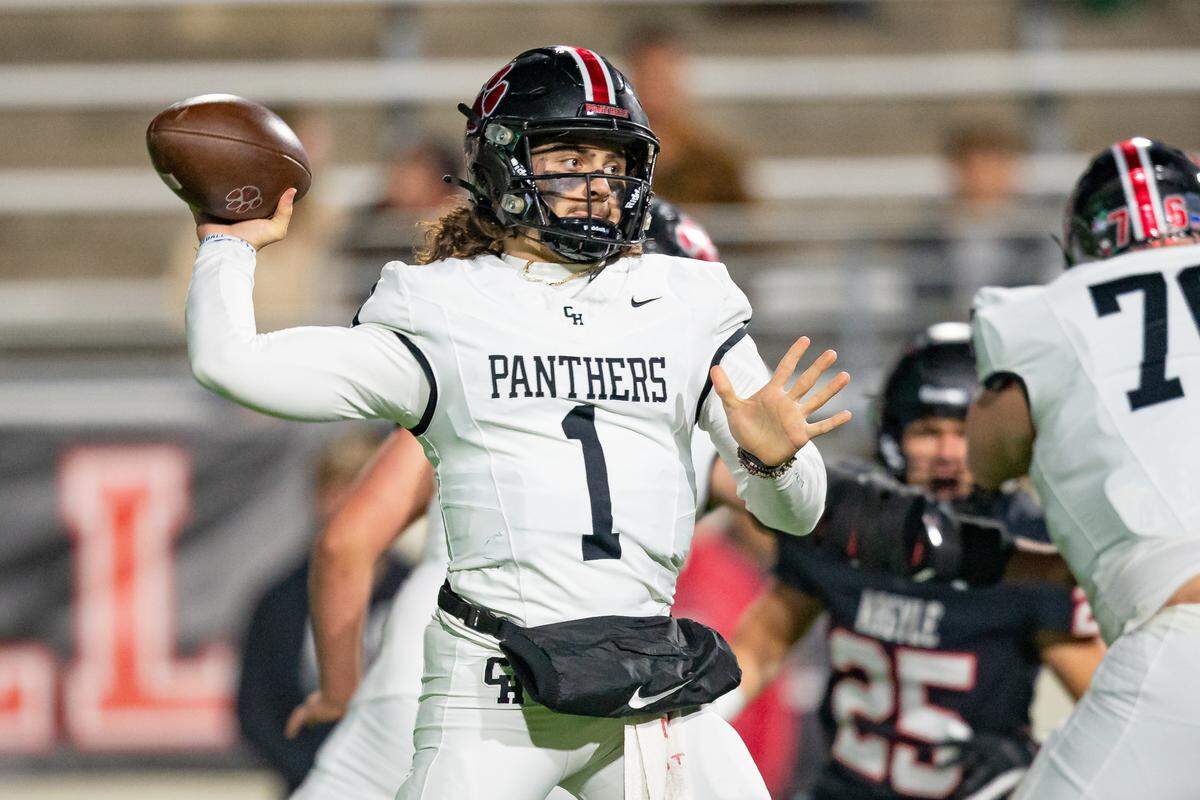 Quarterback Luke Ullrich makes a throw in a playoff game against Argyle.