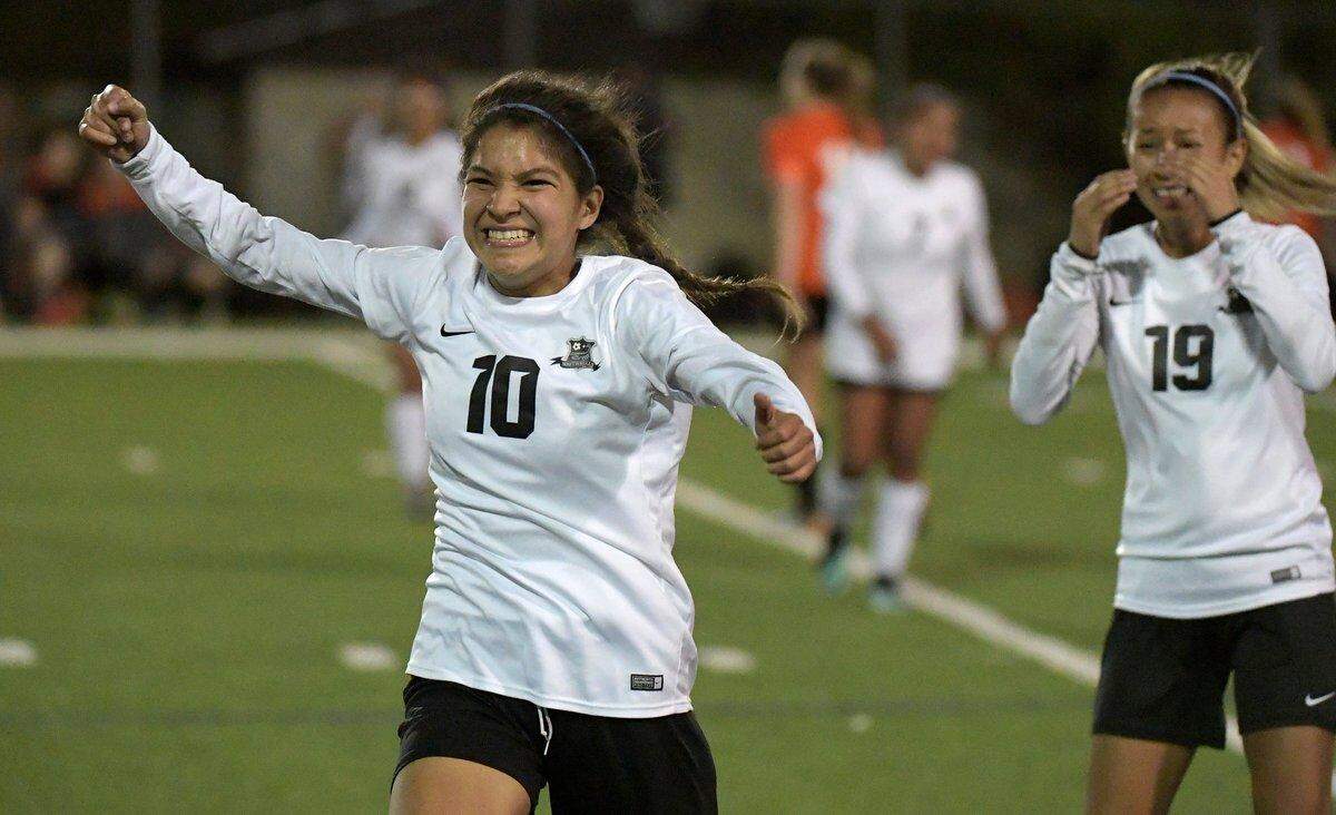 FW South Hills sophomore Johana Rodriguez (10) and senior Karen Sarellano celebrate the Scorpions 2-0 victory over Aledo in the 5A Region I area round at South HIlls HS, April 3, 2018. The Scorpions are headed to the regional quarterfinals for the first time.