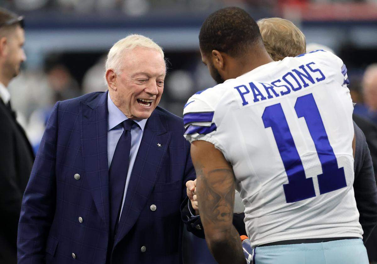 Jan 16, 2022; Arlington, Texas, USA; Dallas Cowboys owner Jerry Jones meets with outside linebacker Micah Parsons (11) prior to the NFC Wild Card playoff football game against the San Francisco 49ers at AT&amp;amp;T Stadium. Mandatory Credit: Kevin Jairaj-USA TODAY Sports