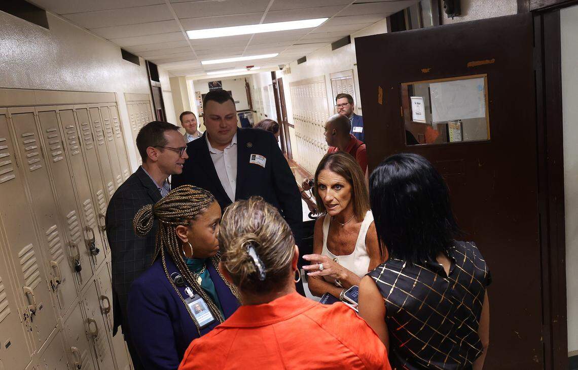Fort Worth Independent School District Superintendent Karen Calvert Molinar, right, talks with others while State Education Commissioner Mike Morath, back left, visits William James Middle School on Thursday, Aug. 28, 2025.