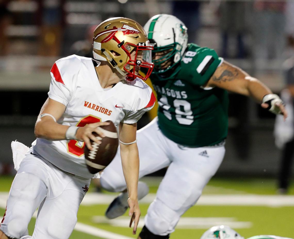 South Grand Prairie quarterback Drake Logan (9) attempts to out run the defense of Southlake’s Quinten Bunten during the first half of a high school football game at Dragon Stadium in Southlake, Texas, Friday, Aug. 30, 2019. at the half. Carroll Dragons led 20-0 at the half. (Special to the Star-Telegram Bob Booth)
