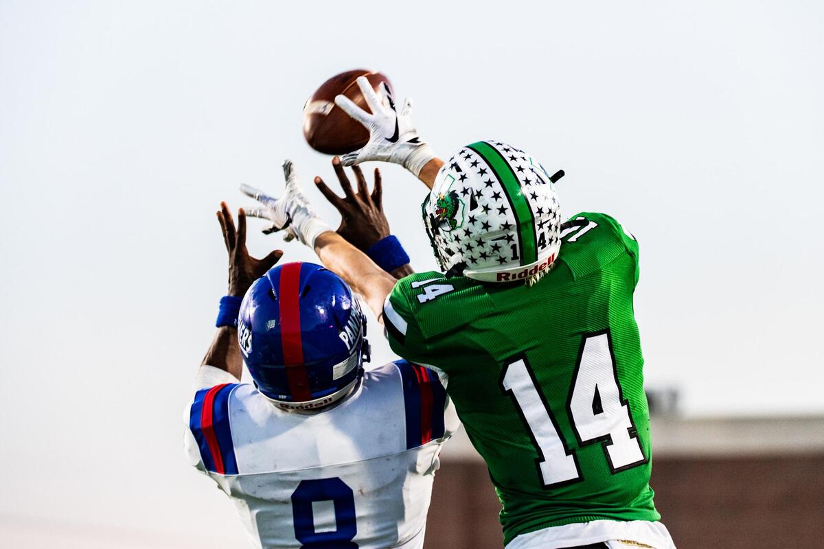 Brady Boyd (14) makes a catch while tightly covered by Jadarius Thursby (8) during the 6A State Quarterfinal at McKinney ISD Stadium on December 7, 2019. Photo: Matt Smith (Special to the Star-Telegram).