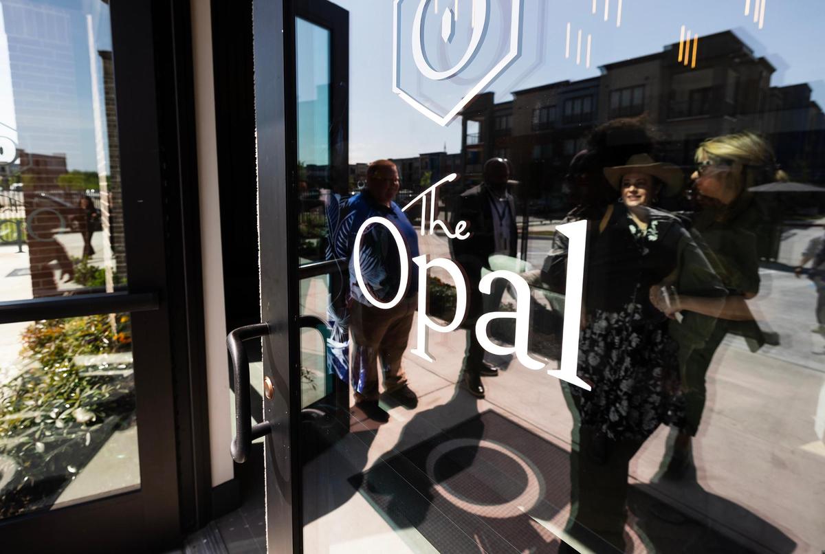 Guests enter main lobby of The Opal, a mixed-income apartment community, for a ribbon cutting and reception celebrating the affordable housing property’s grand opening on Thursday, April 17, 2025.