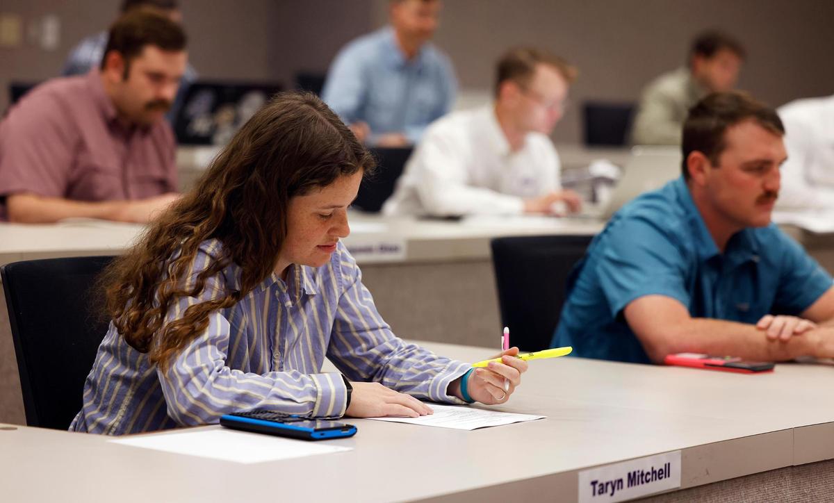 Students enrolled in the Ranch Management program prepare to take a final exam.