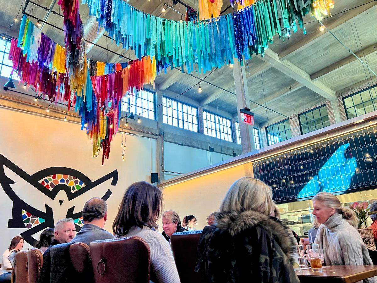 Paloma Suerte is in a former horse and mule barn in the Stockyards’ ”Mule Alley.” Chef Tim Love is at left.