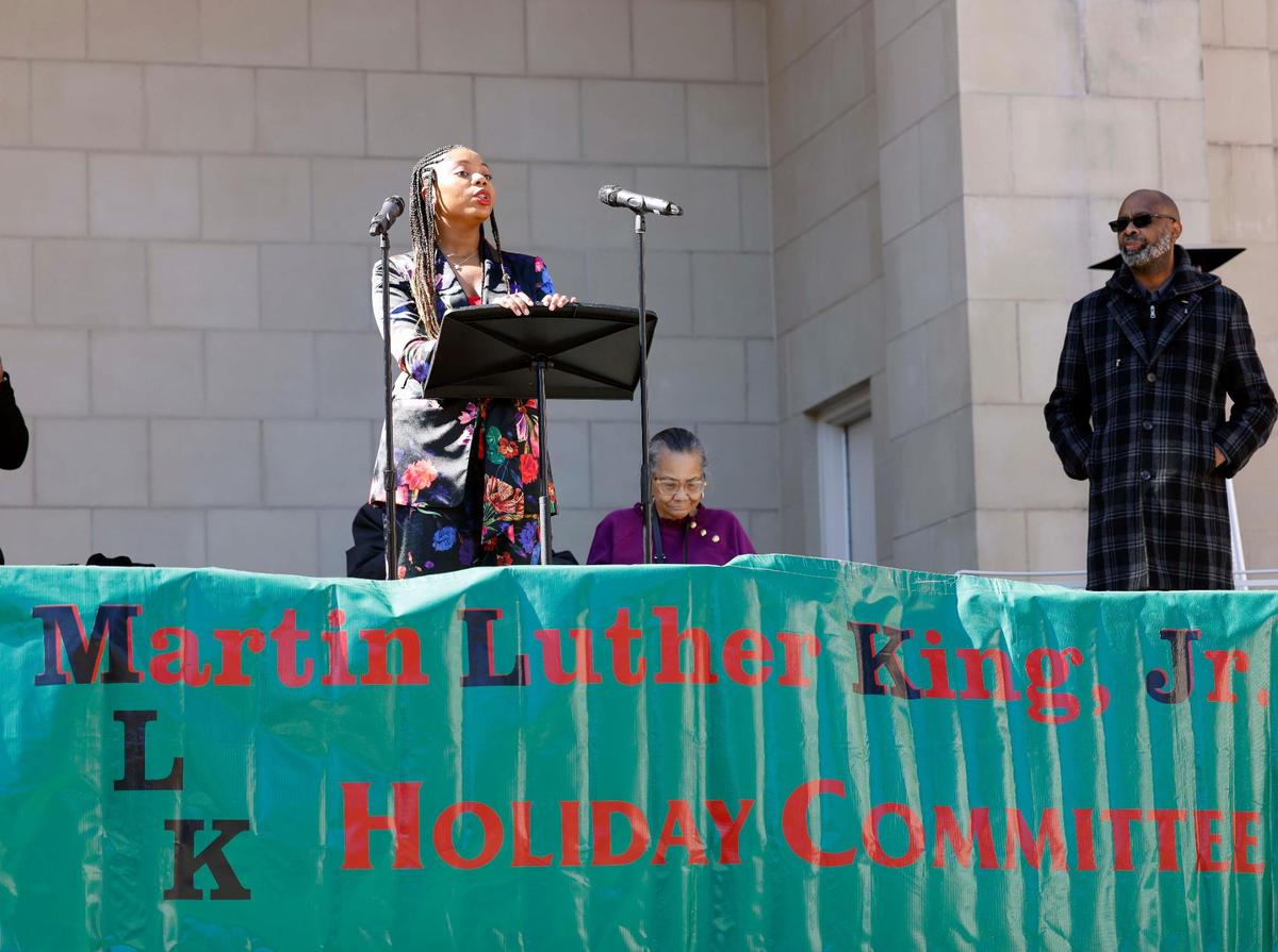 Author April Pelton recites one of her poems during the 2024 MLK parade and rally in downtown Fort Worth on Monday.