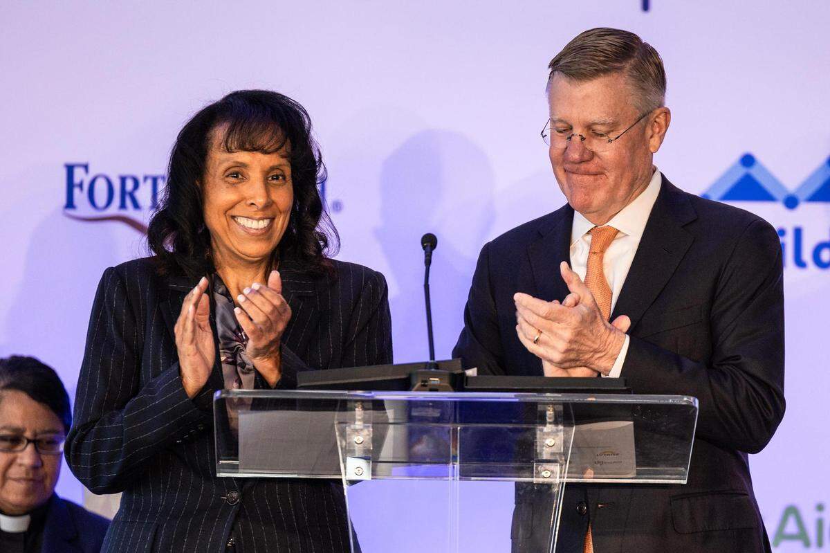 Karen Duncan, the President of JPS Health Network, and Rick Merrill, the President of Cook Children’s Health Care System, speak to the dignitaries gathered during the groundbreaking ceremony for the Las Vegas Trail Neighborhood Health Center in Fort Worth on Tuesday, Nov. 14, 2023.
