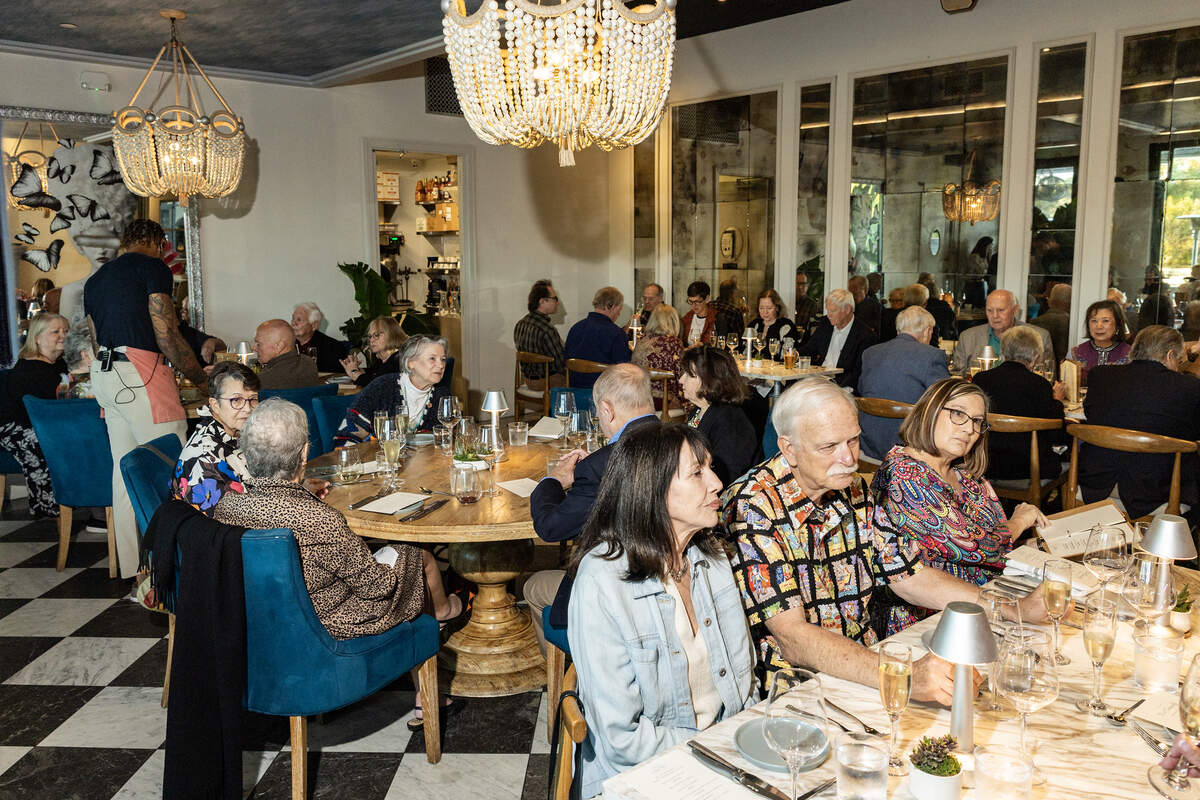 Event attendees speak with each other at the Eats Beat Dinner with Bud at Quince in Fort Worth on Tuesday, Oct. 28, 2025.