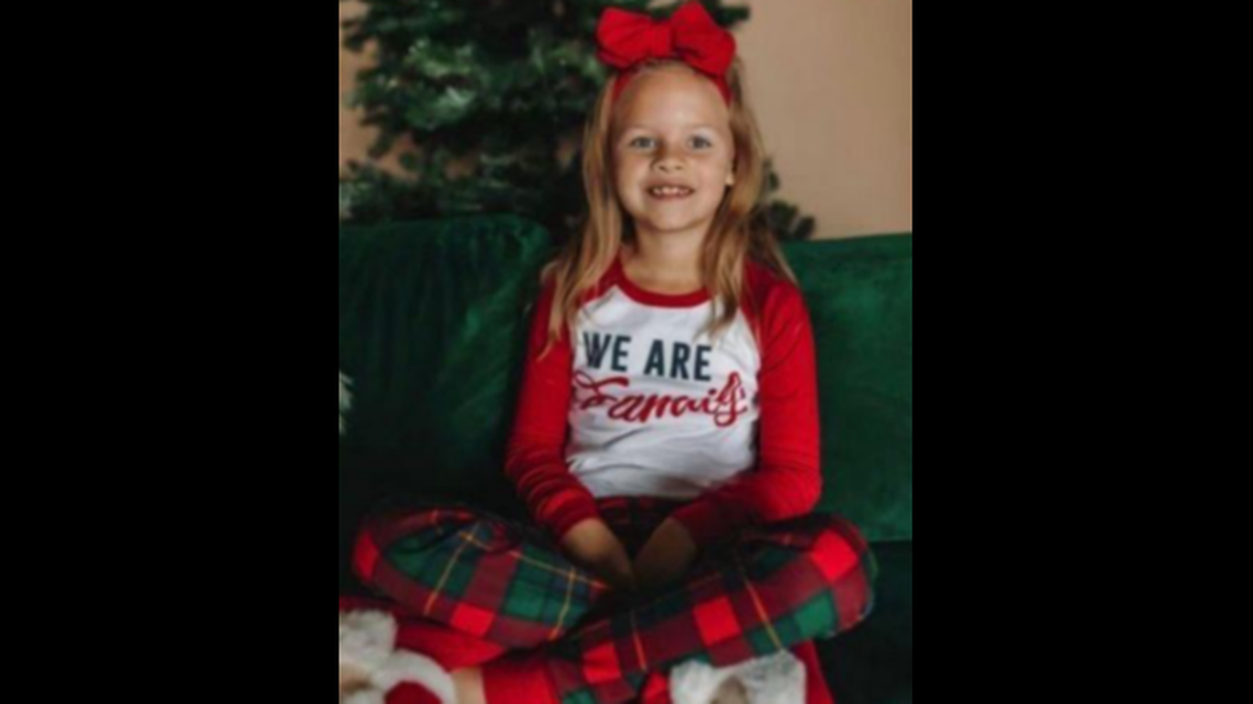 A family photo of 7-year-old Athena Strand wearing Christmas pajamas and a red bow was taken four days before she was killed in November 2022. 