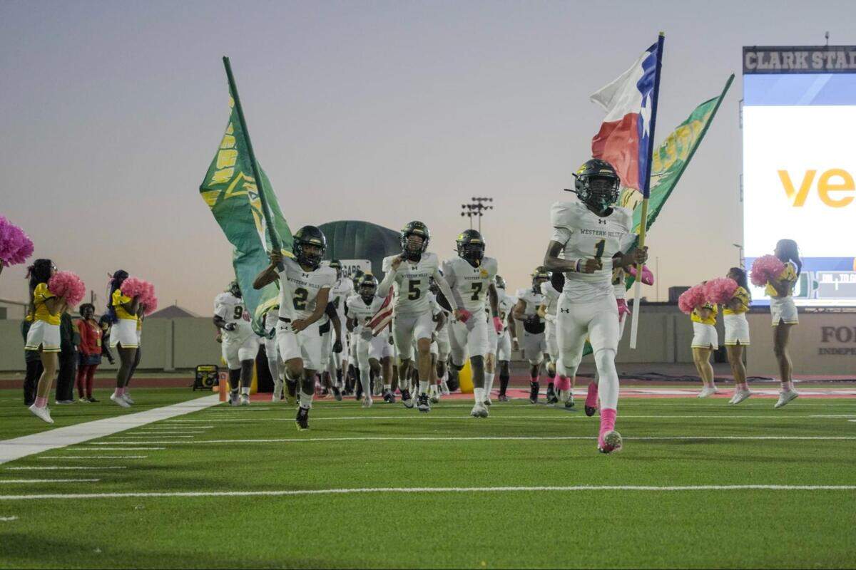 Fort Worth Western Hills runs onto the field during a high school football game against Fort Worth Southwest at Clark Stadium in Fort Worth, Texas, Thursday, October 30, 2025. Southwest won 40-6.