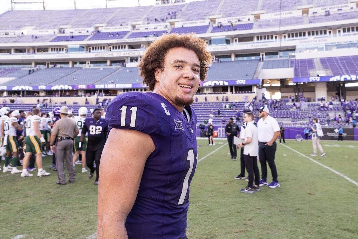 TCU linebacker Devean Deal (11) smiles as he walks off the field following a Big XII football game between the TCU Horned Frogs and the Baylor Bears at Amon G Carter Stadium in Fort Worth on Saturday, Oct. 18, 2025.