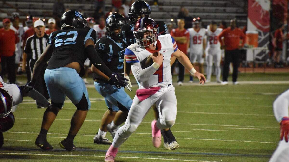 Midlothian Heritage quarterback Carter Rutenbar, an Arkansas baseball commit, runs for a touchdown in the second quarter of a game against Arlington Juan Seguin on Thursday at Wilemon Field in Arlington.
