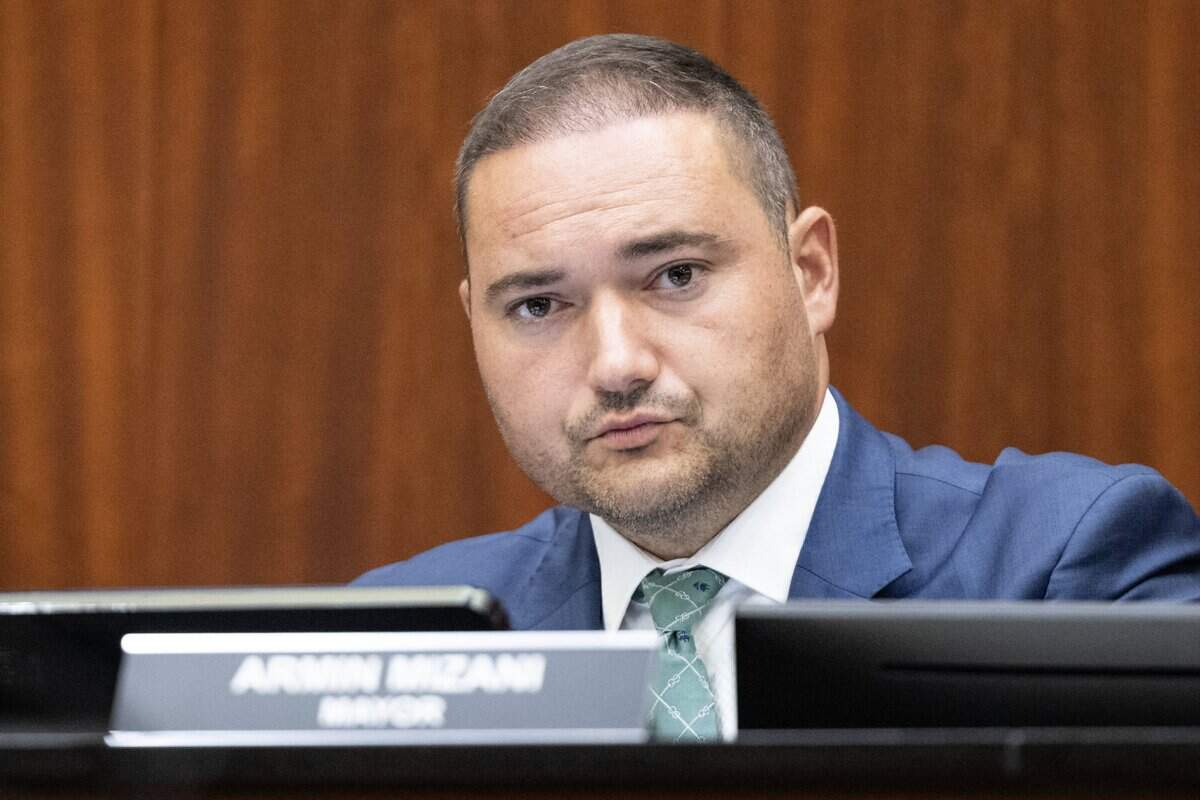 Keller Mayor Armin Mizani listens to public comment during the city council meeting on Tuesday, Aug. 5, 2025. Protesters gathered prior to reject Item 287g on the Keller council meeting agenda is a resolution for the city to join forces with ICE.