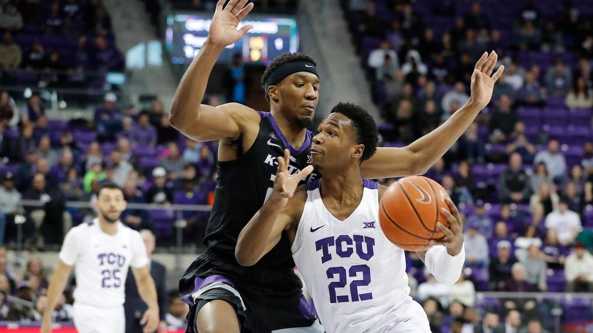 TCU guard RJ Nembhard (22) goes to the net guarded by Kansas State forward Xavier Sneed (20) in the first half Monday in Fort Worth.