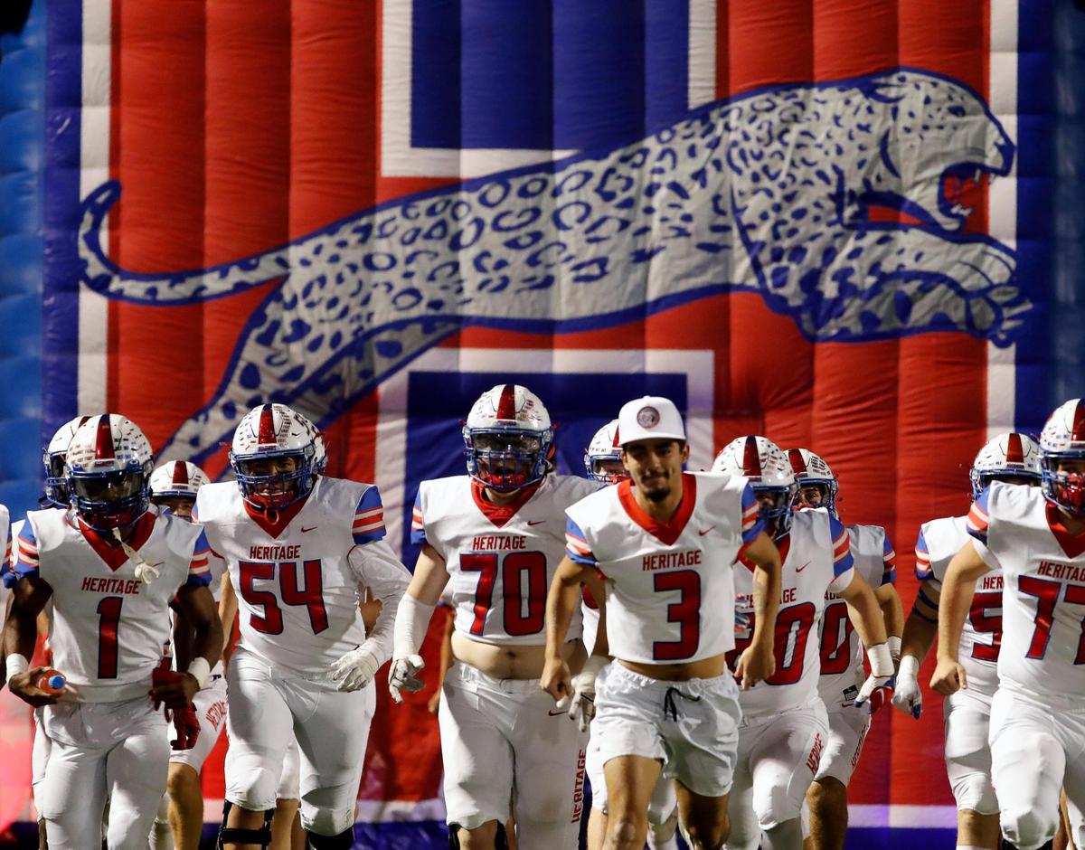 The Heritage Jaguar’s enter the field for the second half of a District 5-5A Division II high school football game at Midlothian ISD Multi-use Stadium in Midlothian, Texas, Friday, Oct. 14, 2022. Midlothian defeated Ennis 38-35. (Special to the Star-Telegram Bob Booth)